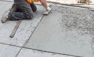 Professional repairing a concrete floor in Pasadena, CA